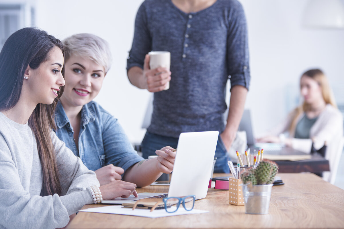 Workers at advert agency creating a digital advertising budget