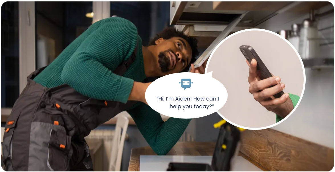 A man in overalls inspects a cabinet above a counter. An inset shows a hand holding a phone displaying a chatbot saying, "Hi, I'm Aiden! How can I help you today?.